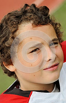 Smiling boy after a tackle football game