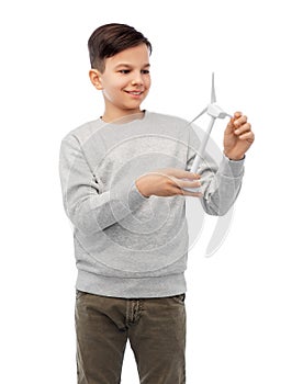 smiling boy with toy wind turbine