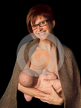 Smiling breastfeeding mother