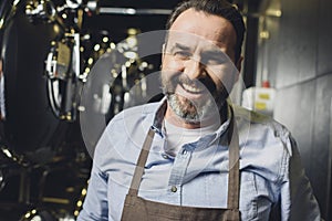 Smiling brewery worker