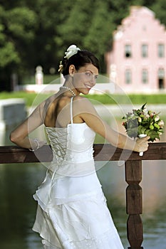 Smiling bride with bouquet