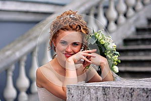 Smiling bride with bouquet