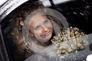 Smiling bride in limo