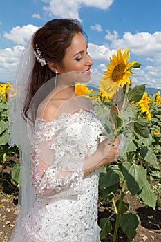 Smiling bride with sunflower