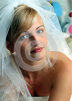 Smiling bride in white dress