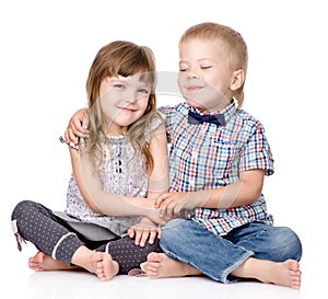 Smiling brother and little sister hugging. isolated on white