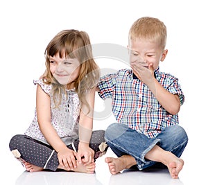 Smiling brother and little sister hugging. on white