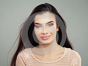 Smiling brunette girl with long healthy hair