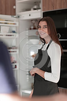 Smiling brunette woman open refrigerator