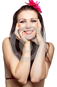 Smiling brunette woman with purple flower