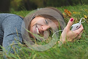 Smiling brunnette woman using cell phone