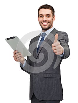 Smiling buisnessman with tablet pc computer