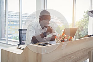 Smiling business black american man, African person working from home and drinking coffee with computer notebook laptop on webcam