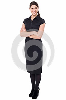 Smiling business executive with arms crossed