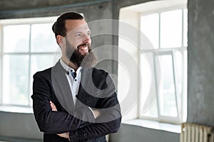 Smiling business man arm crossed office dress code