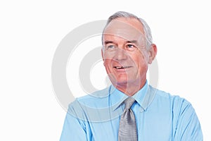 Smiling business man. Closeup of mature business man smiling over white background.