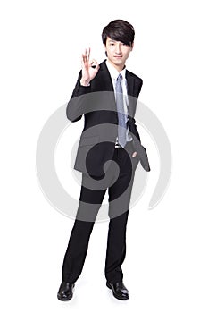 Smiling business man with okay gesture