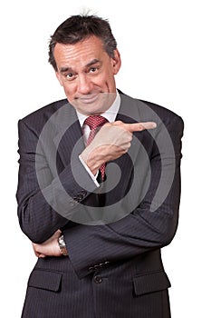 Smiling Business Man in Suit Pointing Right