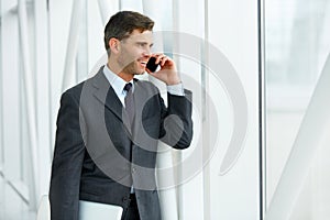 Smiling Business Man Talking on Mobile Phone