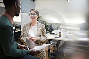 Smiling Business Manager Talking to Employee