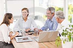 Smiling business people having a meeting