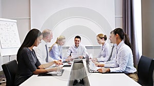 Smiling business people meeting in office