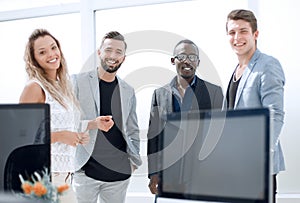 Smiling business team standing in the office