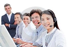 Smiling business team talking on headset