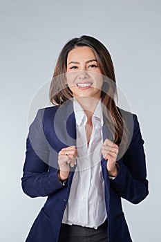 Smiling business woman in blue suit and white shirt isolated white background