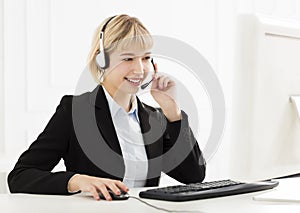 Smiling business woman with headset