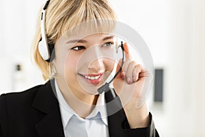 Smiling business woman with headset