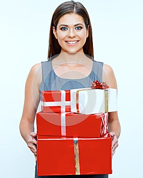 Smiling business woman hold pile of gifts. Red gift box.