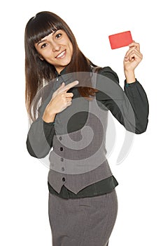 Smiling business woman holding credit card