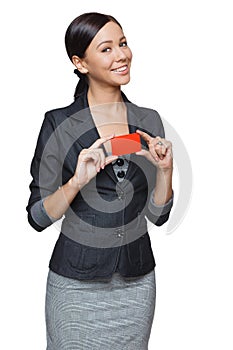 Smiling business woman holding credit card