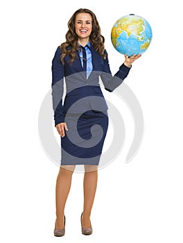 Smiling business woman holding earth globe