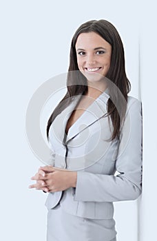 Smiling business woman, Isolated on gray background. crossed arm