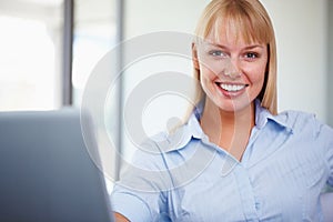 Smiling business woman with laptop. Closeup portrait of beautiful business woman with laptop.