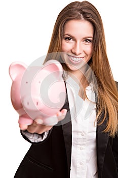 Smiling business woman with a piggy bank