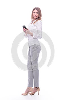 Smiling business woman reading e-mail on her smartphone. isolated on white