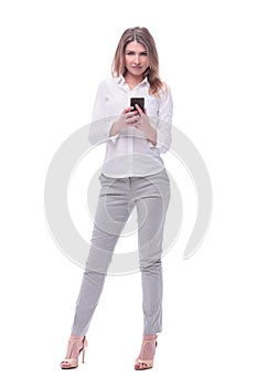 Smiling business woman reading e-mail on her smartphone. isolated on white