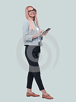 Smiling business woman reading e-mail on her smartphone. isolated on white