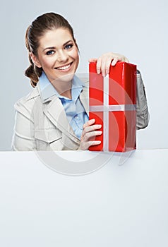 Smiling business woman red gift box hold.