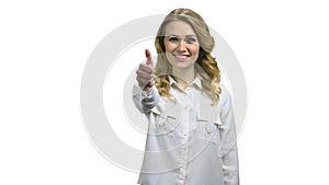 Smiling business woman showing thumb up on white background.