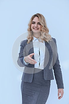 Smiling business woman stretching hand for handshake.