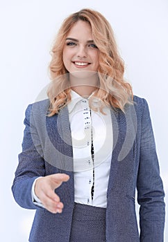 Smiling business woman stretching hand for handshake.