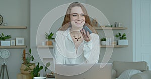 Smiling business woman talking mobile phone at home office. Portrait of joyful girl making phone call at remote