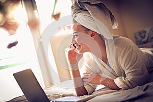 Smiling business woman talking phone at morning.