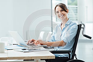 Smiling business woman in wheelchair