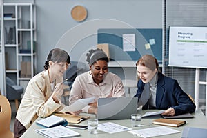 Smiling Business Women Working with Laptop