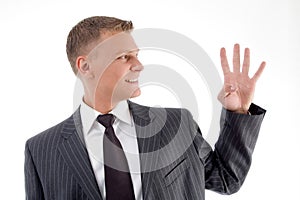 Smiling businessman counting fingers